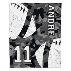 Close-up of distressed football graphics on grey bedding sets single.