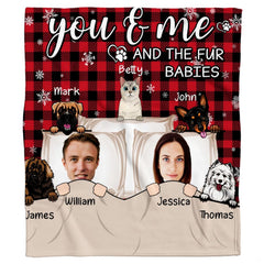 Illustrated couple and cartoon pets on red and black buffalo plaid background, view 2.