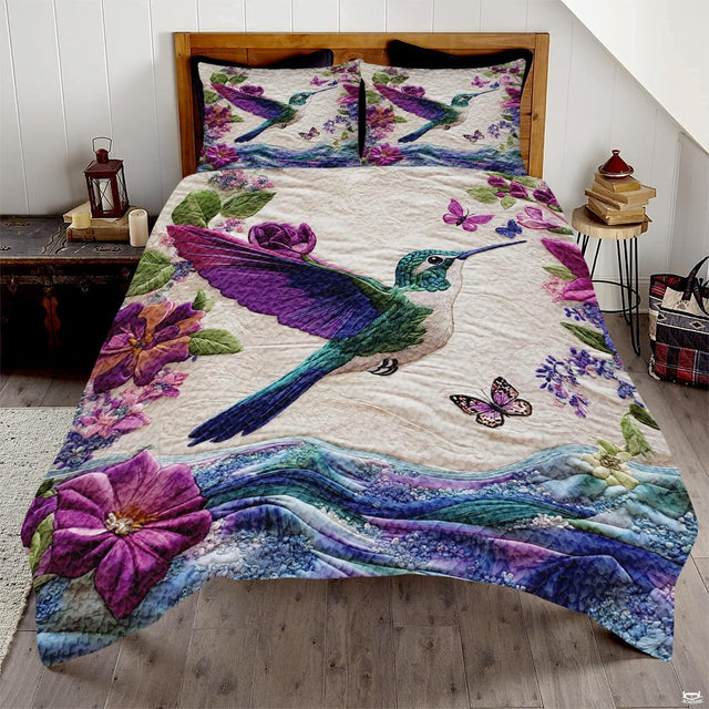 Teal hummingbird with purple wings, butterflies, flowers, and blue wave border