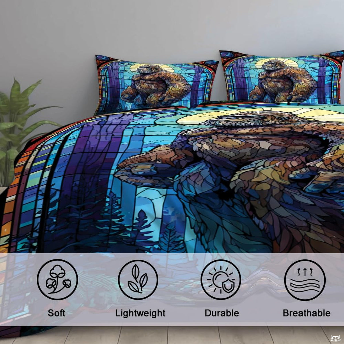 High-angle view of bigfoot graphic bedding showing rich indigo, cerulean blue, and obsidian tones across bed.