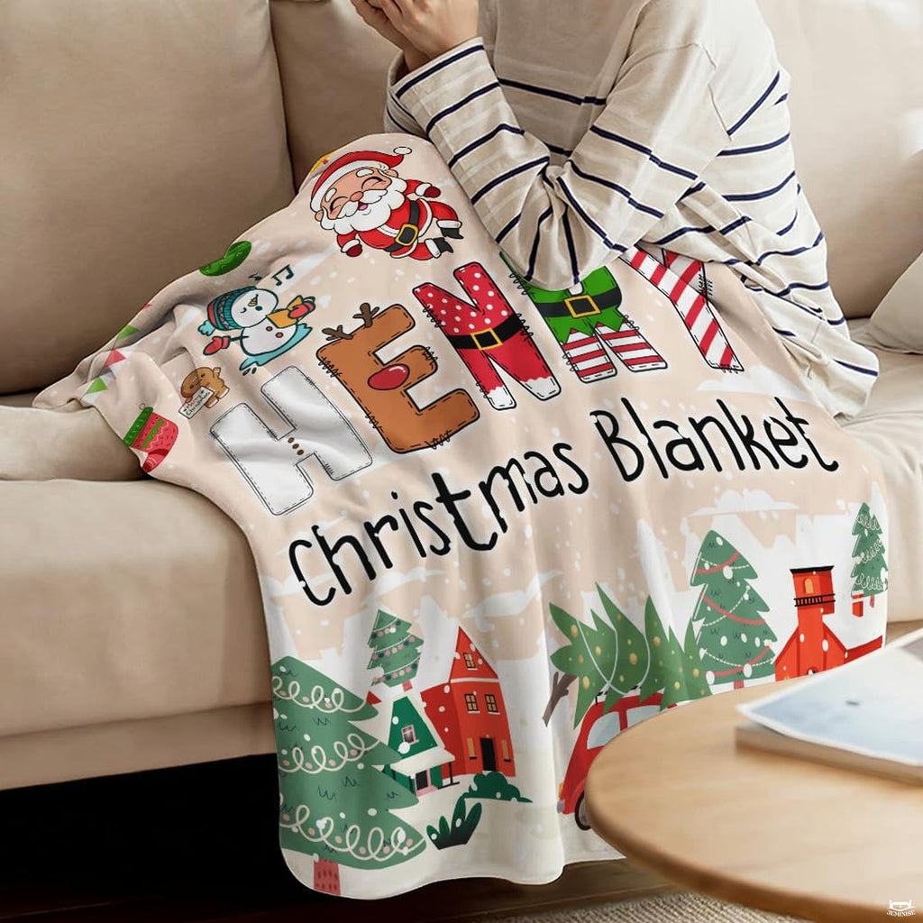 Close view of dancing Santa Claus and singing snowmen on graphic blanket
