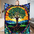 Full view of throw blanket displaying stained glass Tree of Life with golden sunrise and cobalt mosaic border.