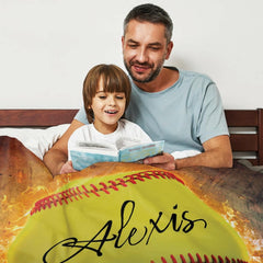 Living room setting showing flaming softball blanket draped across contemporary couch seating