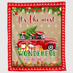 Christmas red truck dogs holiday throw blanket held open showing full seasonal holiday garland artwork