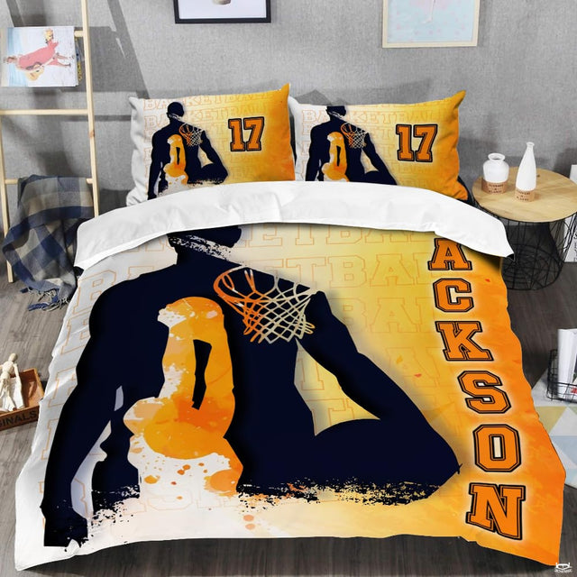 Close-up perspective of basketball bedding showing detailed watercolor splash textures and hoop netting