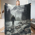 Bigfoot walking through a rocky mountain river toward snow-capped peaks, view 1.