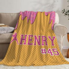 Coordinated bedroom arrangement featuring sports-themed bedding set with playful ice cream artwork.