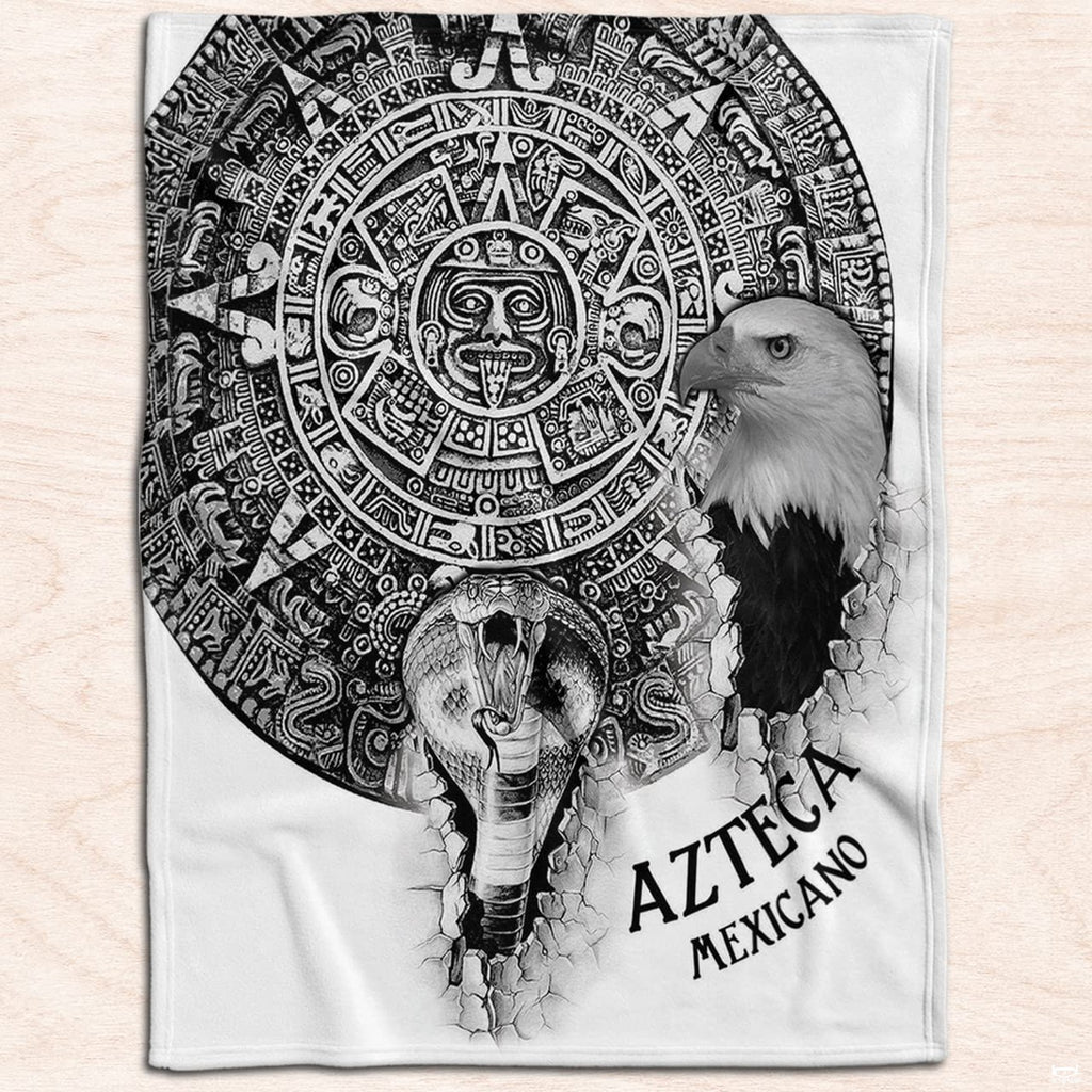Father and child reading in bed covered by Mexican cultural throw blanket