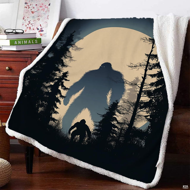 Bigfoot pair blanket draped on armchair featuring dual Sasquatch figures under full moon.