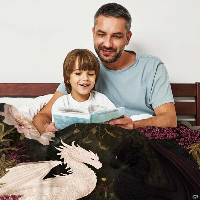 White and black dragons throw blanket view 2 highlighting twin drakes, books, and peony flowers