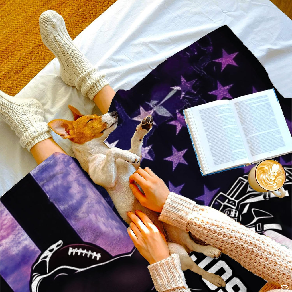 Overhead view of reader with sleeping puppy on white bedding beside the cosmic sports design.