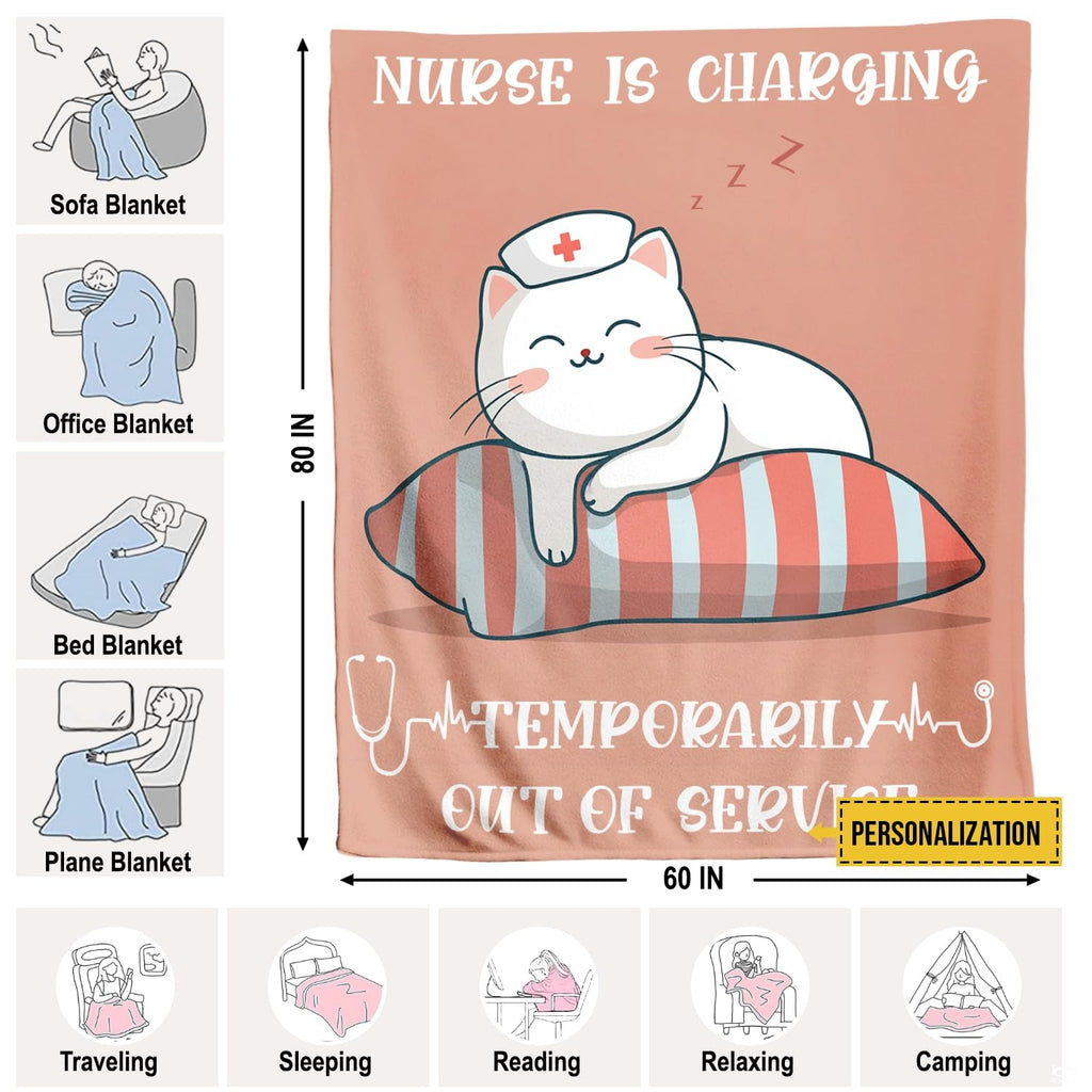Folded sleeping nurse cat cartoon throw blanket resting on wooden table displaying pink artwork