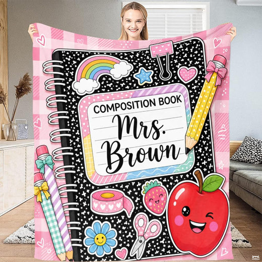 Stationery doodle bedding set featuring a speckled notebook pattern, pink gingham trim, and smiling red apple artwork.