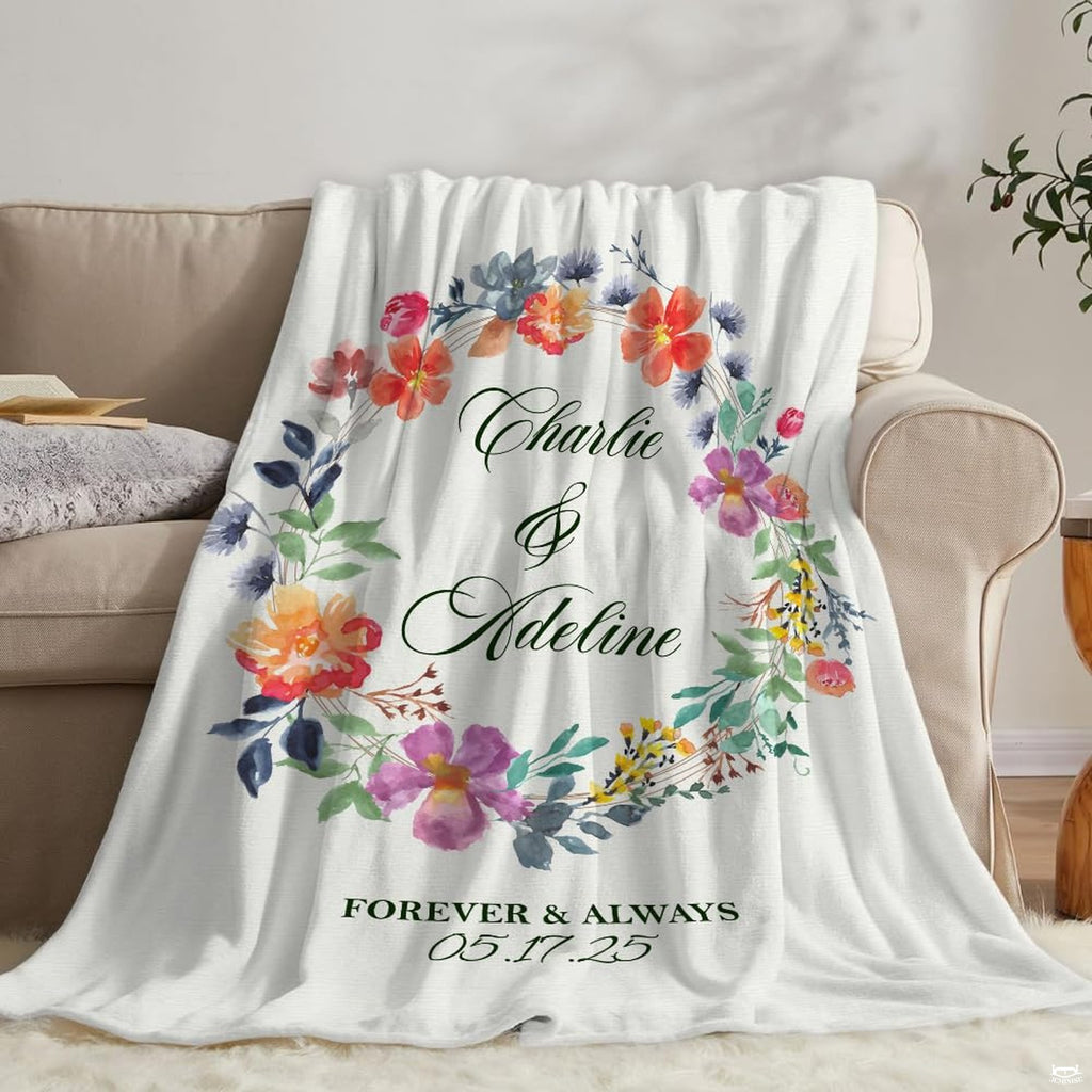 Overhead perspective of watercolor botanical wreath bedding set centered neatly against clean white styling.