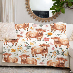 Artistic watercolor illustration detail of yellow floral stems and sweet highland calf on bedding.