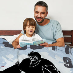Hockey goalie silhouette blanket draped over an armchair in a sunlit living room setting.