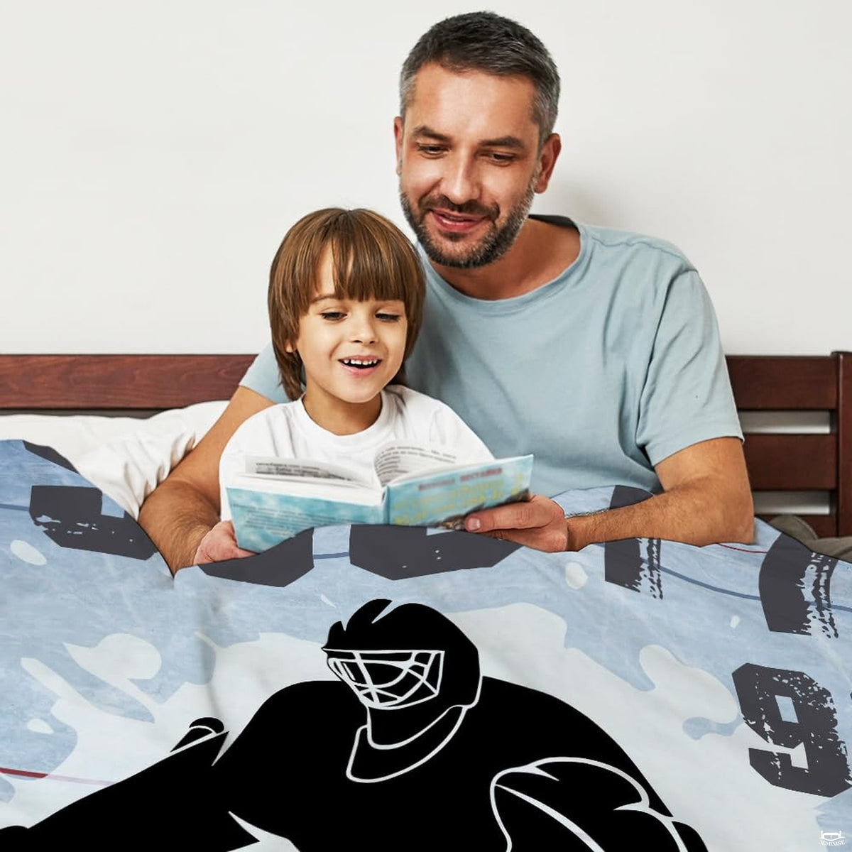 Hockey goalie silhouette blanket draped over an armchair in a sunlit living room setting.