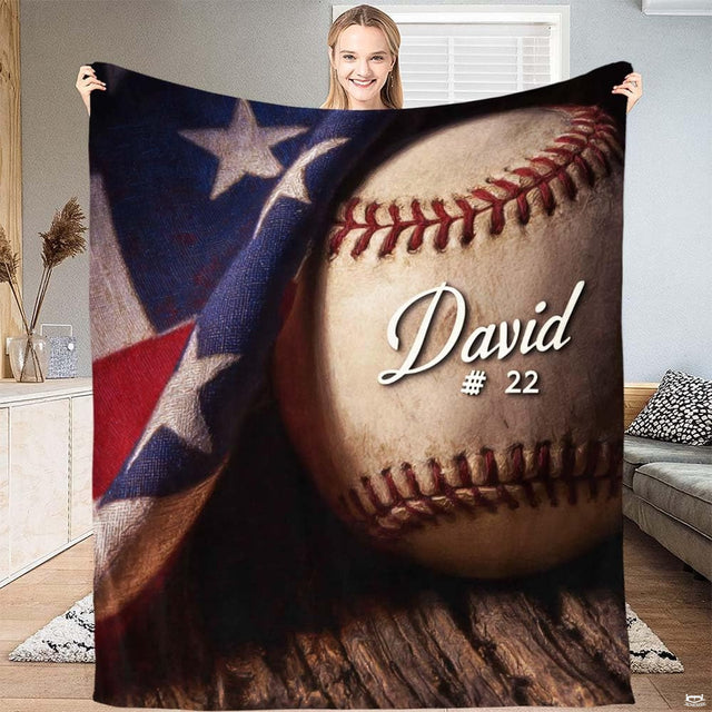 Overhead view of baseball sports illustration on patriotic red, white, and navy bedding.