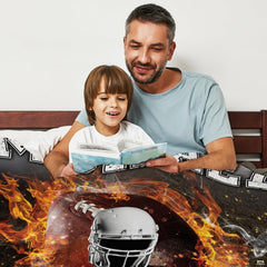 Close-up perspective of roaring orange fire and white football helmet on sports throw blanket