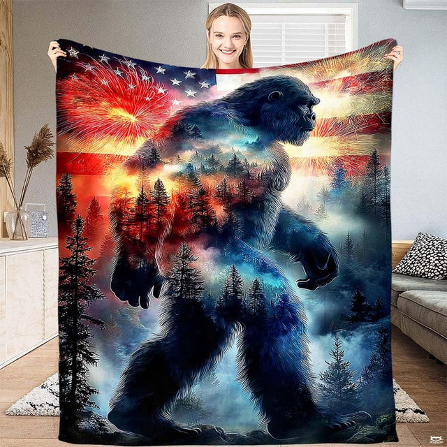 Patriotic Bigfoot flag fireworks throw blanket featuring double-exposure Sasquatch and American flag fireworks