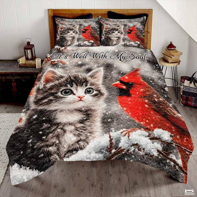 Winter Cat and Cardinal Sitting on Snowy Patchwork Christmas Quilt