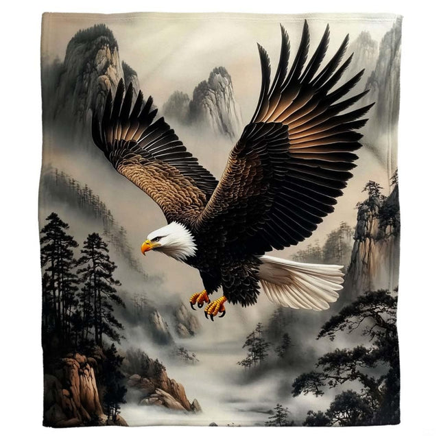 Detailed view of bald eagle head and outstretched wings against atmospheric alpine mist.