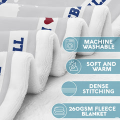 Close-up of thematic accent sports bedding graphic highlighting bold blue paint splatters and athletic borders.
