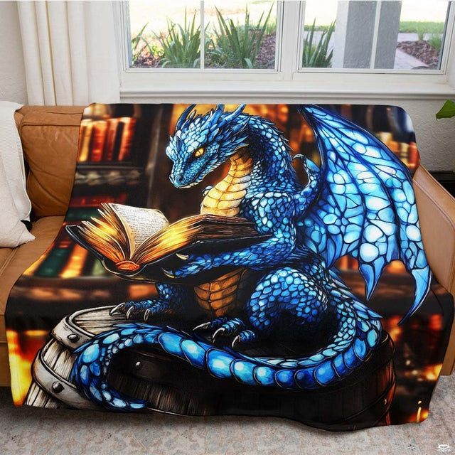 Living room sofa displaying the fantasy blue dragon library reading throw blanket.