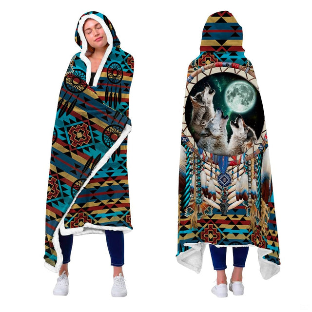 Person wrapped indoors in the howling wolf dreamcatcher design blanket showing front and back views.