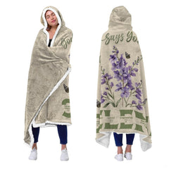 Christian floral scripture hooded blanket draped across living room armchair