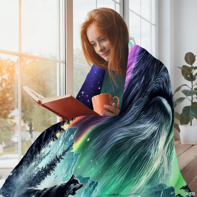Person reading near window wrapped in vibrant emerald and purple aurora night sky artwork.