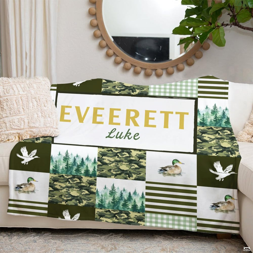 Bedroom lifestyle setting showing the rustic outdoor duck blanket styled across a bed.