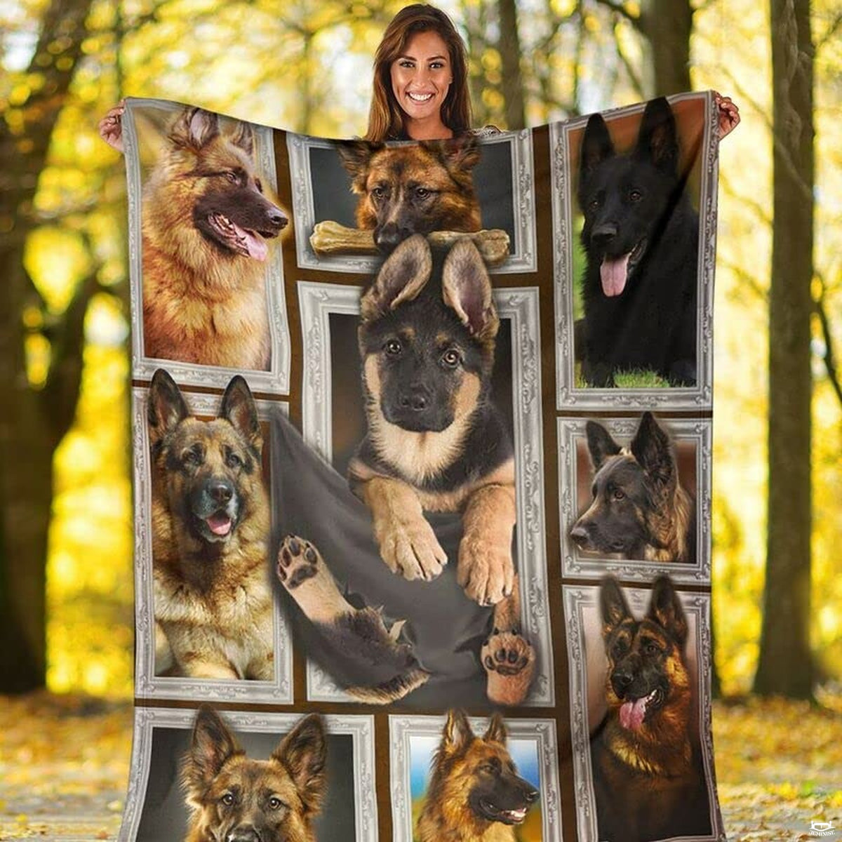 Outdoor view of a model holding up the full German Shepherd gallery throw blanket.