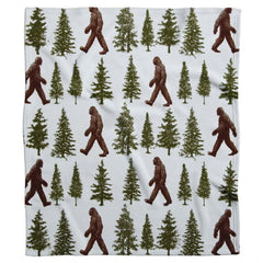 Rustic Sasquatch bed spread theme featuring dark brown figures and forest green pine trees.