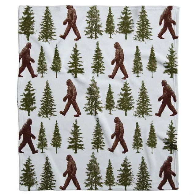 Rustic Sasquatch bed spread theme featuring dark brown figures and forest green pine trees.