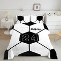 Minimalist geometric soccer bedding displaying oversized black and white hexagonal ball panel artwork