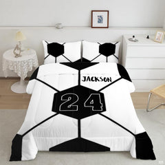 Minimalist geometric soccer bedding displaying oversized black and white hexagonal ball panel artwork