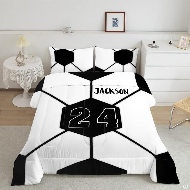 Minimalist geometric soccer bedding displaying oversized black and white hexagonal ball panel artwork