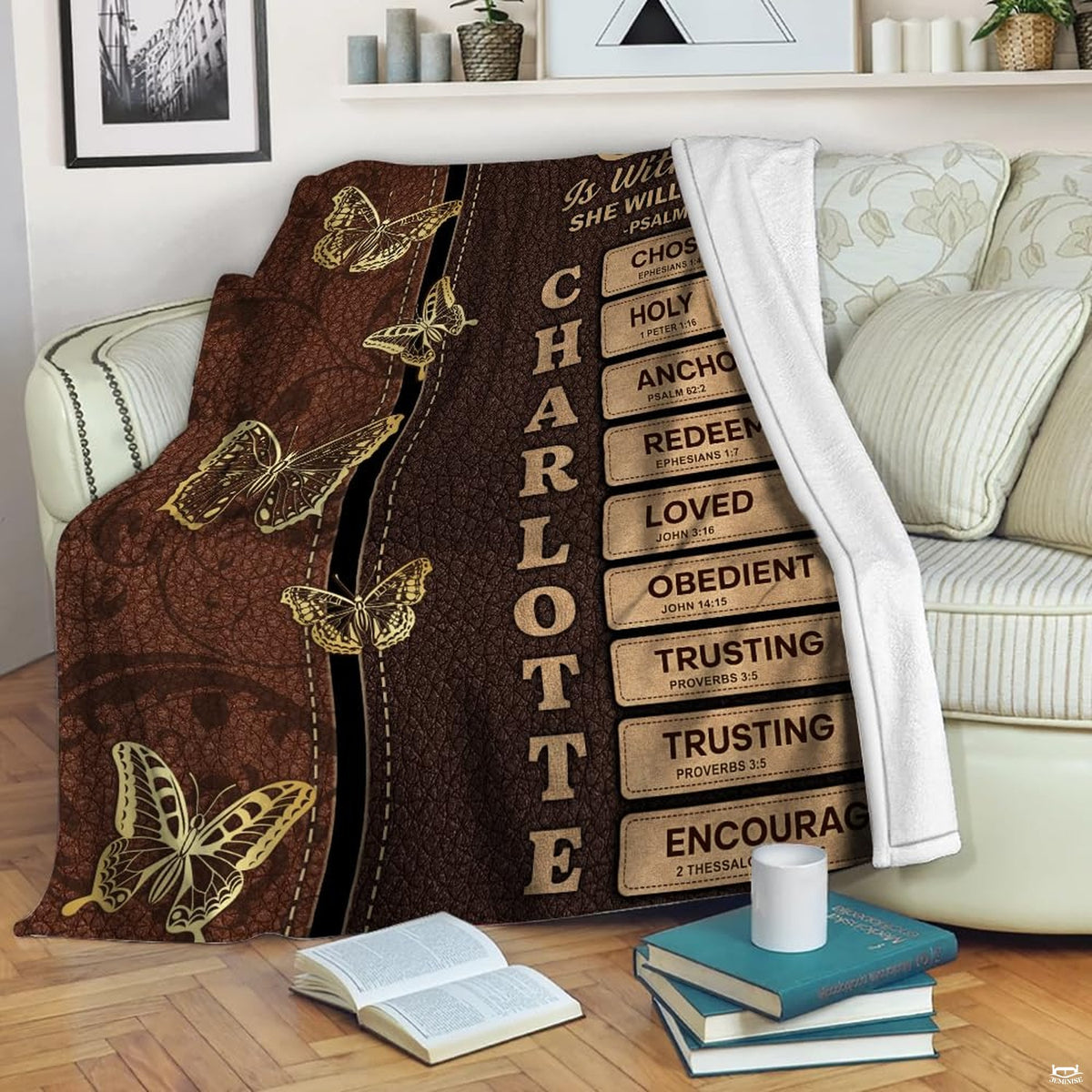 Overhead view of brown faux thematic accent bedding sets showing detailed golden butterfly artwork and stitched badge...