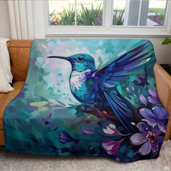 Turquoise hummingbird garden throw blanket view 4 highlighting blue plumage artwork and home decor styling