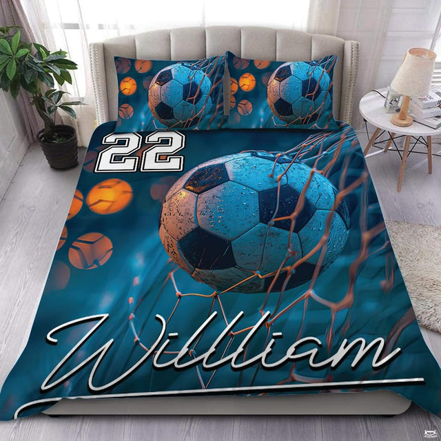 Soccer goal artwork bedding set with vivid blue splash motif and glowing net in modern bedroom decor.
