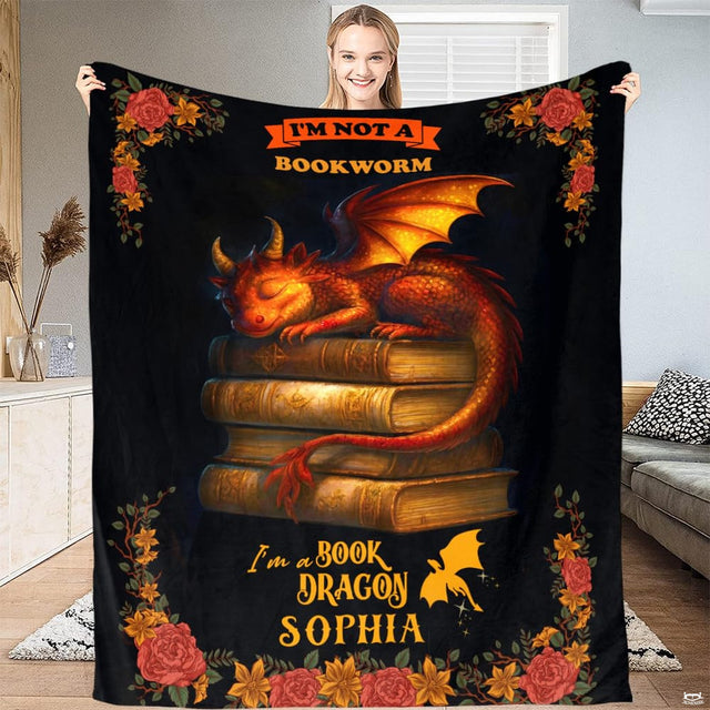 Sleeping book dragon antique books fantasy blanket showing curled baby dragon view 1