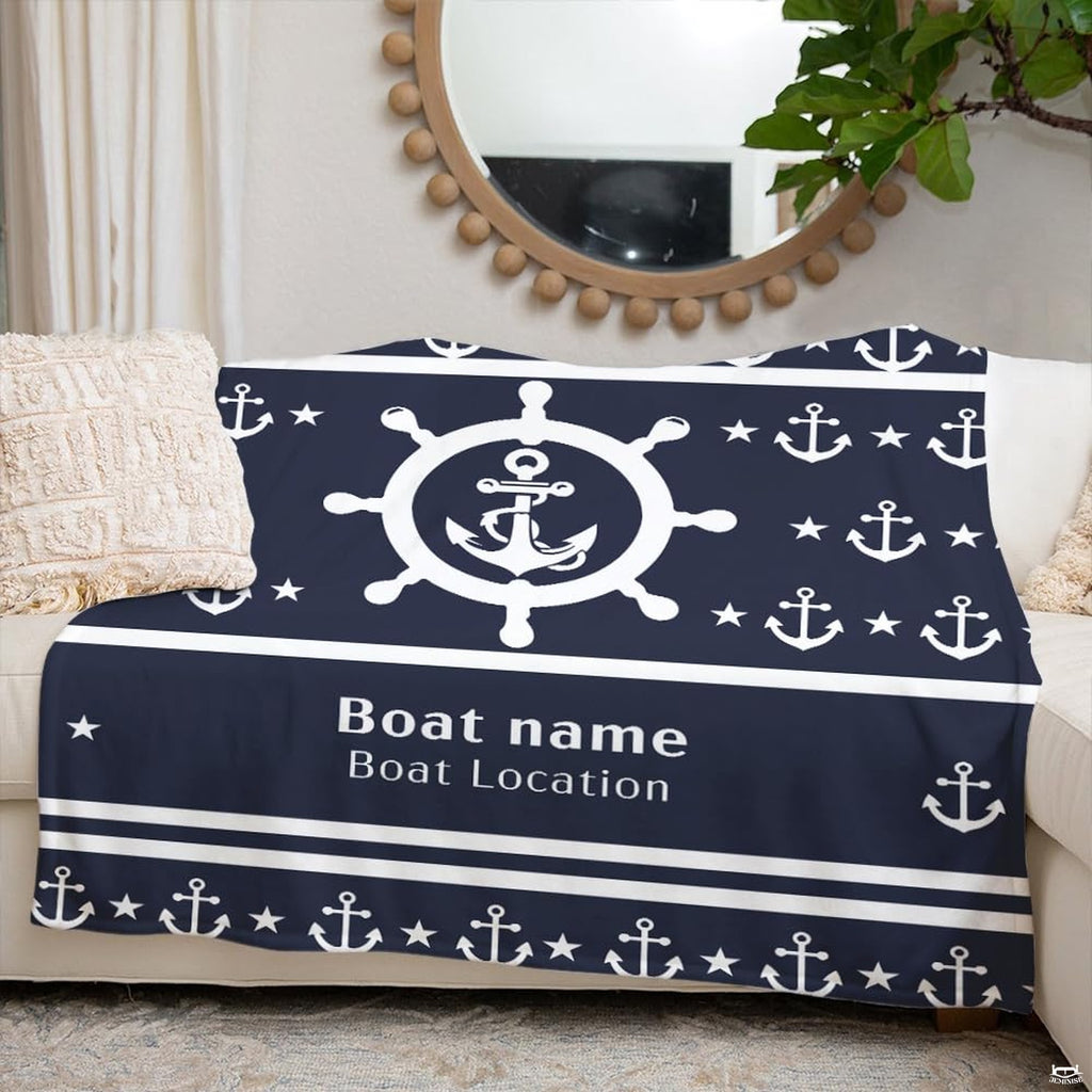 Folded nautical blanket highlighting navy and white contrast