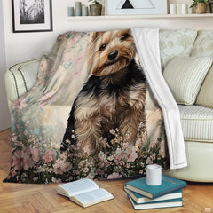 Close-up of painted blush petals, cream blossoms, and muted green foliage on floral dog bed pink bedding.