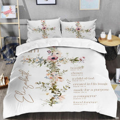 Close-up view of Christian bedding highlighting detailed wooden cross artwork and scripture typography