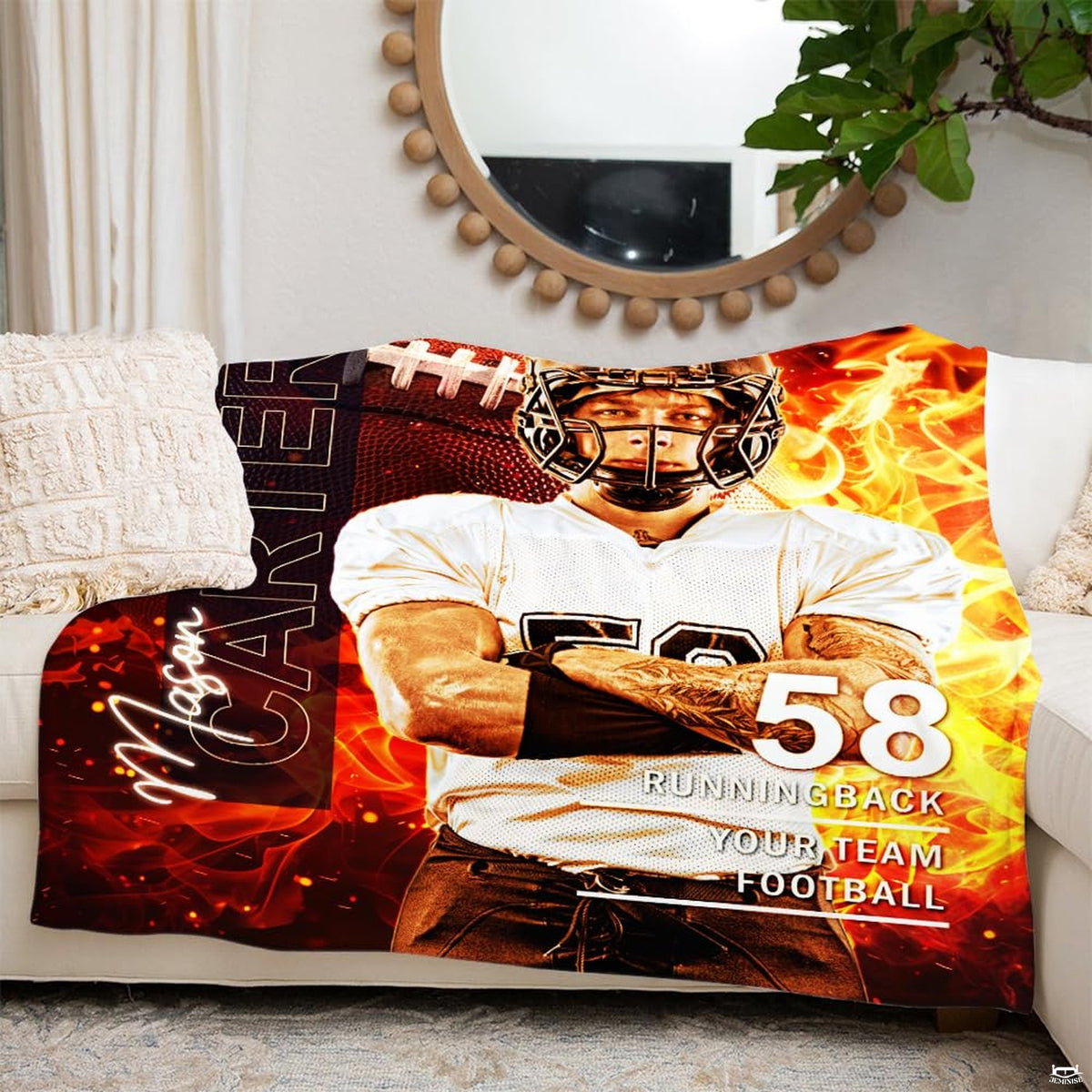 Folded athletic blanket highlighting vibrant orange fire and helmet graphics