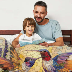 Close-up of stained glass mosaic tiles depicting colorful hummingbird wings.
