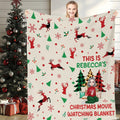 Front view of reindeer Christmas movie throw blanket held upright displaying leaping plaid stags.
