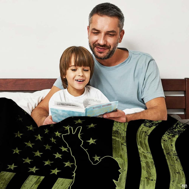 Tactical green Bigfoot American flag throw blanket view 2 styled on living room couch in lodge home