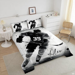 Close-up perspective of black and white athletic skater watercolor splash artwork on bedding set display.